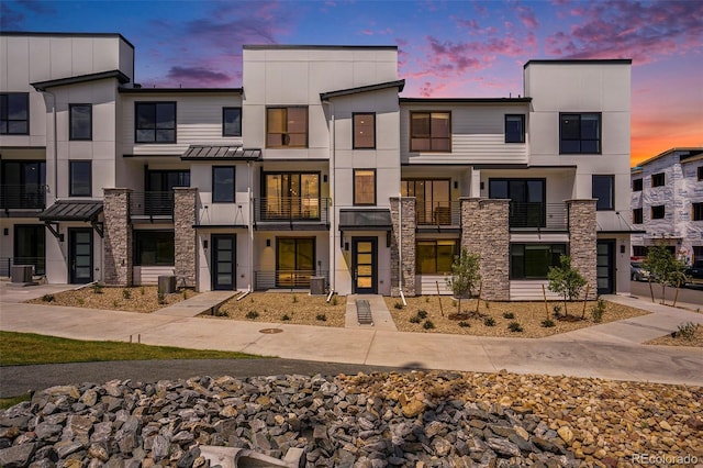 2076 S Holly St Unit 1, Denver, CO 80222 - view of front of property featuring stone siding and stucco siding