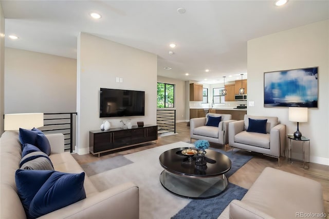 2076 S Holly St Unit 1, Denver, CO 80222 - living area featuring recessed lighting and light wood-style flooring