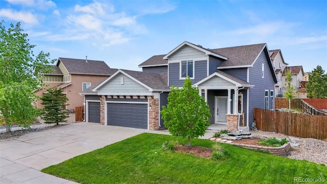 12532 Mount Belford Way, Peyton, CO 80831 - craftsman house with stone siding, an attached garage, concrete driveway, and roof with shingles