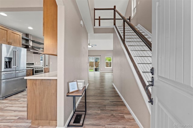 12532 Mount Belford Way, Peyton, CO 80831 - foyer featuring light wood-type flooring, baseboards, stairs, recessed lighting, and a ceiling fan