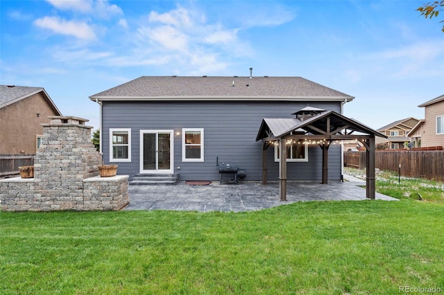 12532 Mount Belford Way, Peyton, CO 80831 - rear view of house featuring a patio, a gazebo, entry steps, and a shingled roof