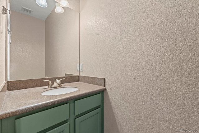 12532 Mount Belford Way, Peyton, CO 80831 - bathroom featuring vanity and a textured wall