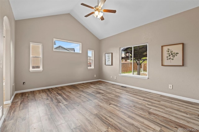 12532 Mount Belford Way, Peyton, CO 80831 - empty room with ceiling fan, wood finished floors, high vaulted ceiling, and baseboards
