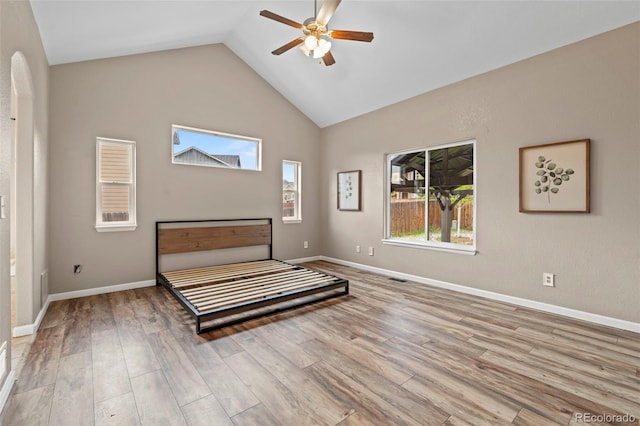 12532 Mount Belford Way, Peyton, CO 80831 - bedroom featuring wood finished floors, high vaulted ceiling, baseboards, and ceiling fan