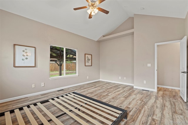 12532 Mount Belford Way, Peyton, CO 80831 - unfurnished room with wood finished floors, a ceiling fan, baseboards, and high vaulted ceiling