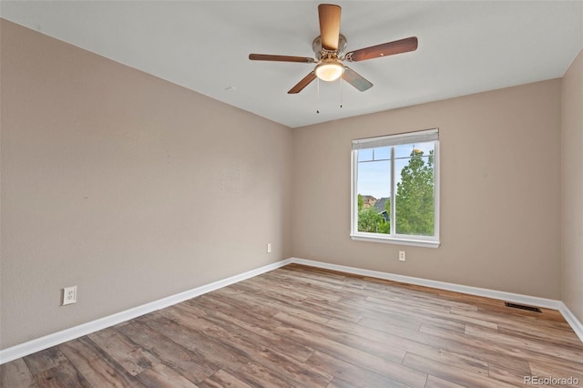 12532 Mount Belford Way, Peyton, CO 80831 - unfurnished room with baseboards, wood finished floors, and a ceiling fan
