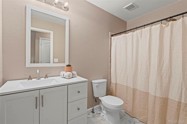 12532 Mount Belford Way, Peyton, CO 80831 - full bathroom with marble look tile flooring, toilet, a textured wall, and vanity