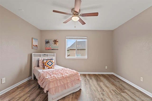 12532 Mount Belford Way, Peyton, CO 80831 - bedroom featuring wood finished floors, baseboards, and a ceiling fan