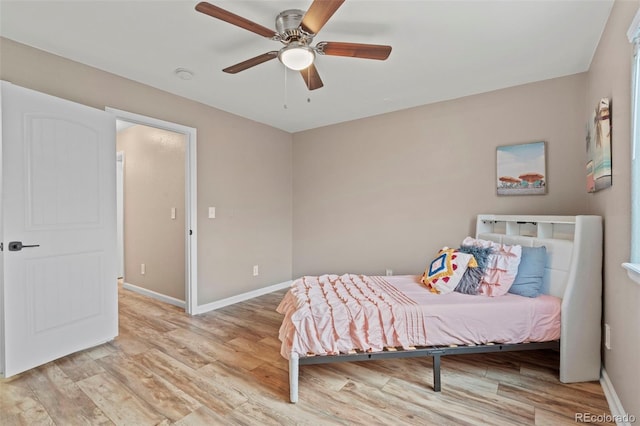12532 Mount Belford Way, Peyton, CO 80831 - bedroom with light wood-style flooring, baseboards, and ceiling fan