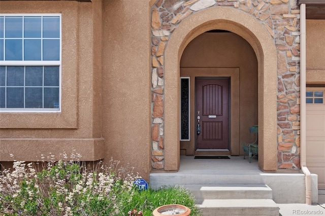 15616 Soo Line Way, Monument, CO 80132 - doorway to property with stone siding and stucco siding