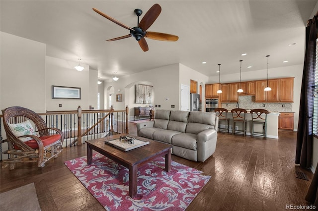 15616 Soo Line Way, Monument, CO 80132 - living area with arched walkways, a ceiling fan, dark wood-style floors, and recessed lighting