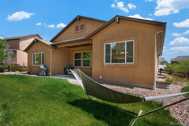 15616 Soo Line Way, Monument, CO 80132 - back of property with stucco siding and a patio area