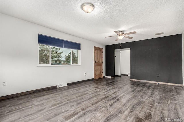 710 4th St, Bennett, CO 80102 - empty room with wood finished floors, a ceiling fan, a textured ceiling, and baseboards