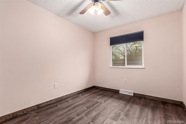 710 4th St, Bennett, CO 80102 - empty room with a textured ceiling, a ceiling fan, dark wood-style flooring, and baseboards