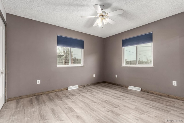 710 4th St, Bennett, CO 80102 - empty room featuring light wood-type flooring, a textured ceiling, ceiling fan, and baseboards