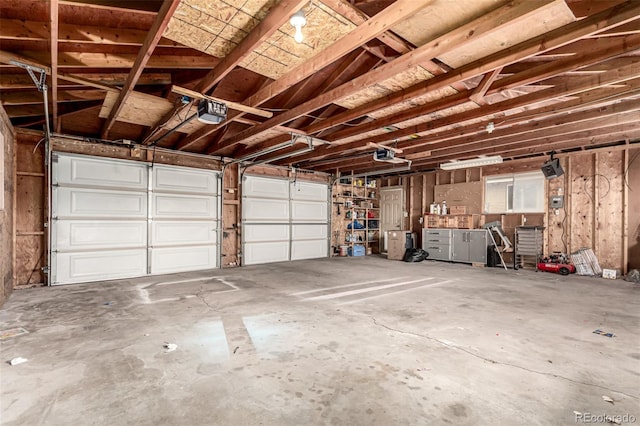 710 4th St, Bennett, CO 80102 - garage featuring a garage door opener