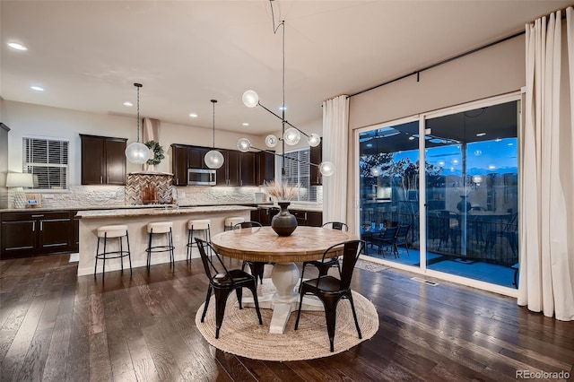 dining space featuring dark hardwood / wood-style floors