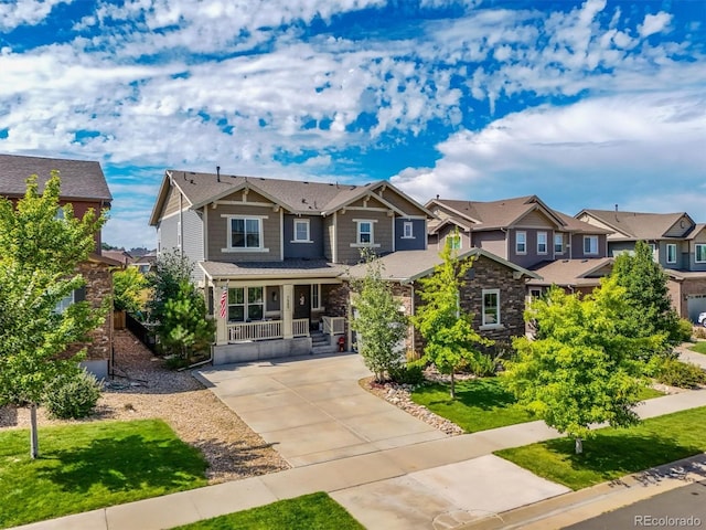 craftsman inspired home with a front yard and a porch