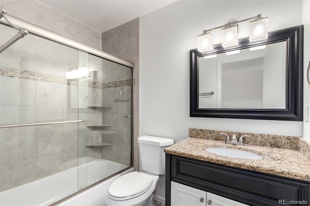 772 Ivywood Ct, Highlands Ranch, CO 80126 - bathroom with vanity, toilet, and bath / shower combo with glass door