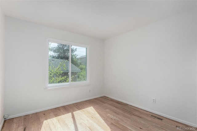 772 Ivywood Ct, Highlands Ranch, CO 80126 - spare room featuring wood finished floors and baseboards
