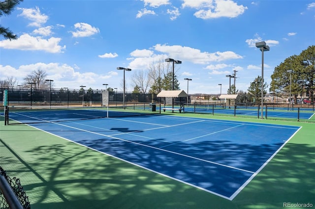 view of tennis court with fence