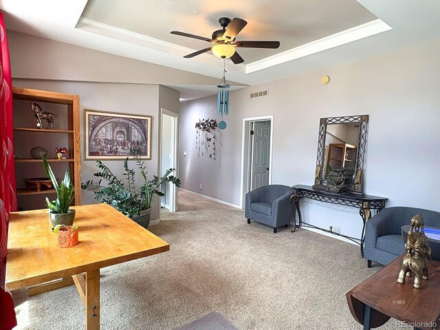 29 Granada Ct, Silver Cliff, CO 81252 - carpeted living area featuring a raised ceiling, a ceiling fan, and baseboards