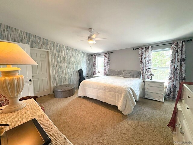 29 Granada Ct, Silver Cliff, CO 81252 - bedroom with wallpapered walls, multiple windows, carpet, and a ceiling fan