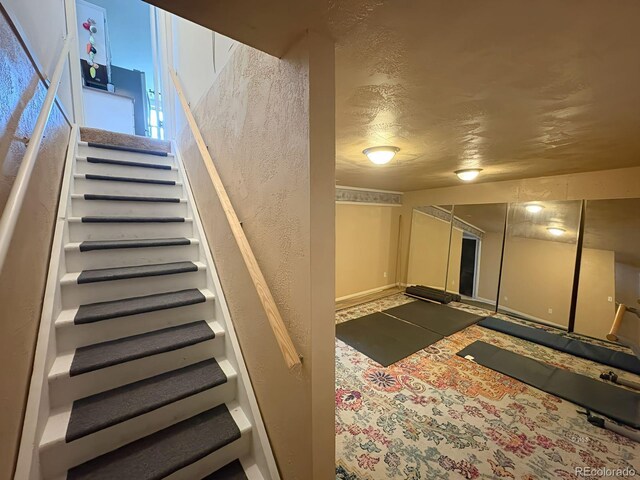 29 Granada Ct, Silver Cliff, CO 81252 - staircase with a textured wall