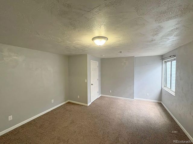 29 Granada Ct, Silver Cliff, CO 81252 - carpeted spare room featuring a textured ceiling and baseboards