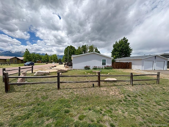 29 Granada Ct, Silver Cliff, CO 81252 - view of side of home featuring a garage