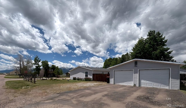 29 Granada Ct, Silver Cliff, CO 81252 - view of side of property featuring an outbuilding and a garage