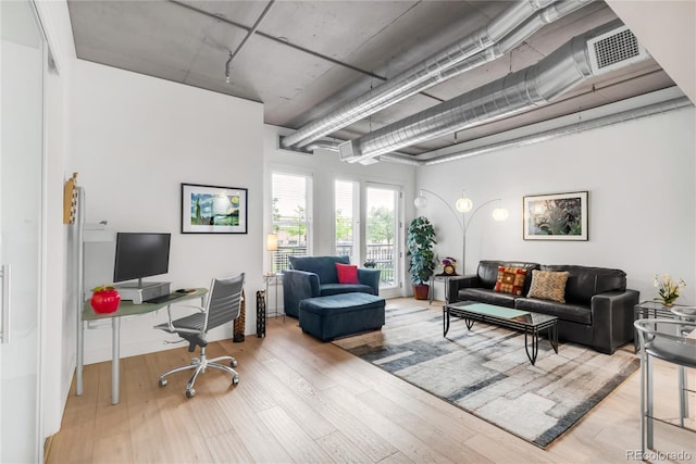 3401 Arapahoe Ave Unit 105, Boulder, CO 80303 - living area with an office area and wood finished floors