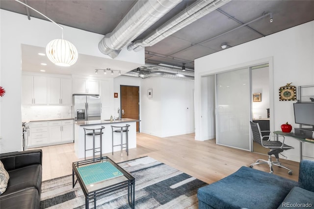 3401 Arapahoe Ave Unit 105, Boulder, CO 80303 - living area featuring light wood-type flooring and an office area