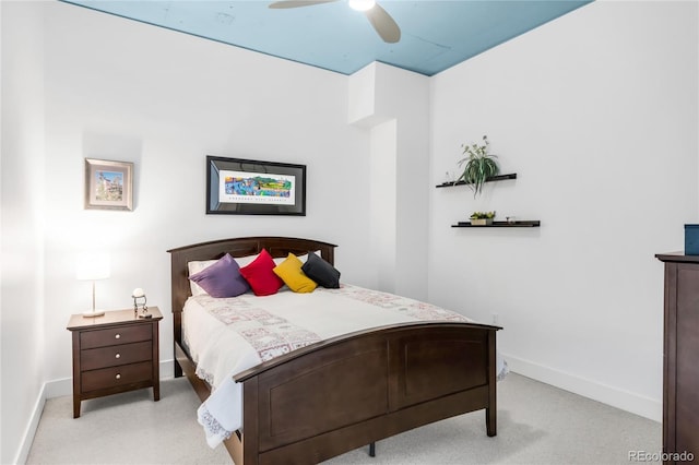 3401 Arapahoe Ave Unit 105, Boulder, CO 80303 - bedroom with baseboards, light carpet, and a ceiling fan