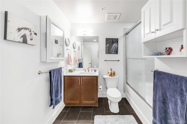 3401 Arapahoe Ave Unit 105, Boulder, CO 80303 - bathroom featuring tile patterned flooring, toilet, vanity, enclosed tub / shower combo, and baseboards