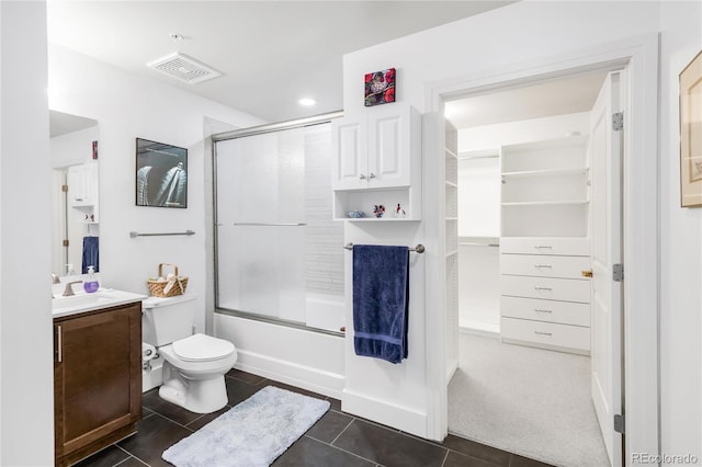 3401 Arapahoe Ave Unit 105, Boulder, CO 80303 - bathroom with vanity, tile patterned floors, enclosed tub / shower combo, and toilet