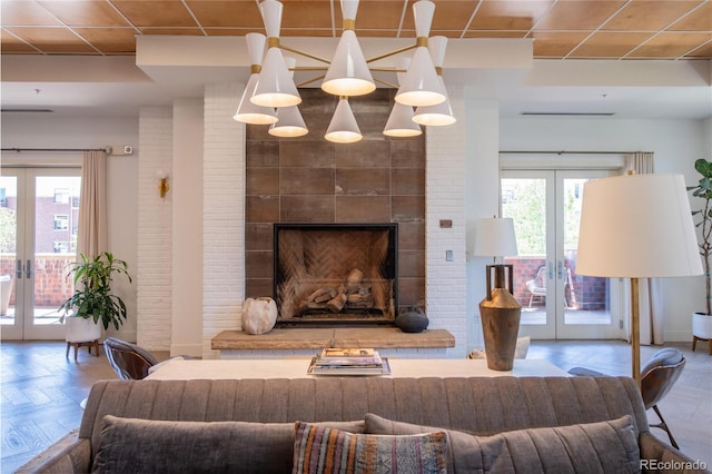 3401 Arapahoe Ave Unit 105, Boulder, CO 80303 - living area featuring french doors and a large fireplace
