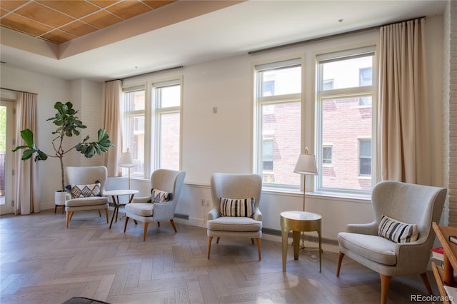 3401 Arapahoe Ave Unit 105, Boulder, CO 80303 - living area featuring baseboards and a raised ceiling