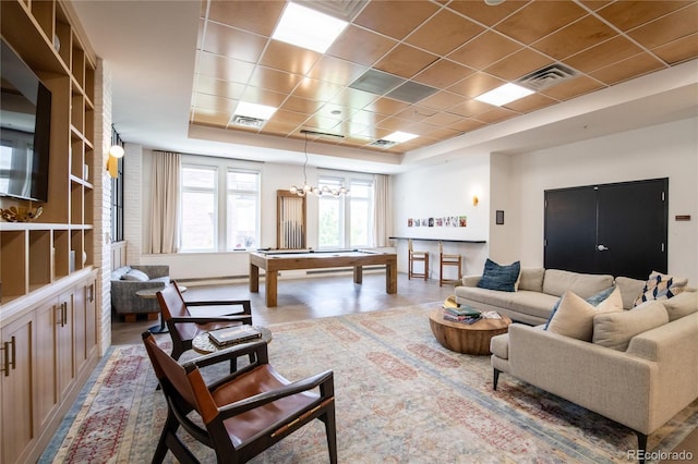 3401 Arapahoe Ave Unit 105, Boulder, CO 80303 - living area featuring a raised ceiling, billiards table, and a chandelier