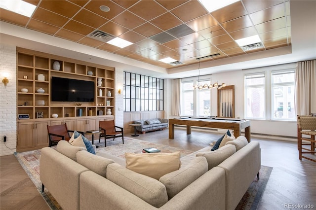 3401 Arapahoe Ave Unit 105, Boulder, CO 80303 - living room with a tray ceiling, built in shelves, baseboards, and pool table