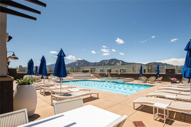 3401 Arapahoe Ave Unit 105, Boulder, CO 80303 - community pool featuring a patio area, a mountain view, a community hot tub, and outdoor dining area