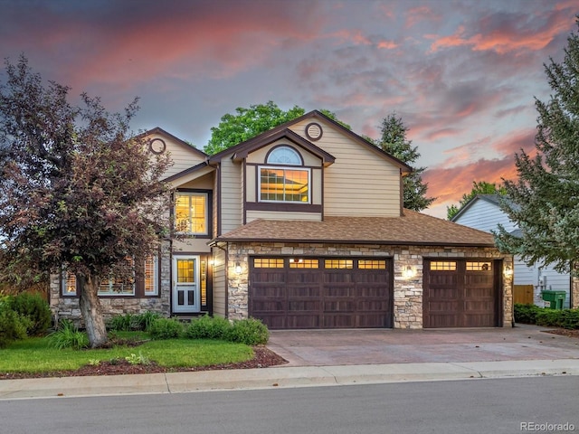 10954 W 100th Way, Broomfield, CO 80021 - traditional-style house featuring stone siding, driveway, a garage, and a shingled roof