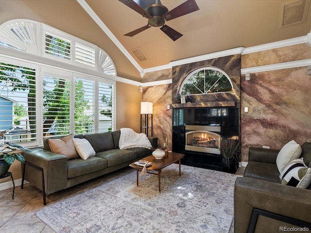 10954 W 100th Way, Broomfield, CO 80021 - living area featuring plenty of natural light, a ceiling fan, high vaulted ceiling, a high end fireplace, and ornamental molding