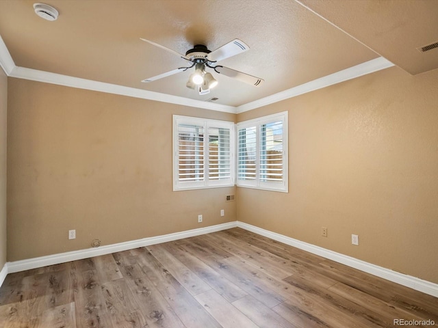 10954 W 100th Way, Broomfield, CO 80021 - unfurnished room with ceiling fan, crown molding, wood finished floors, and a smoke detector