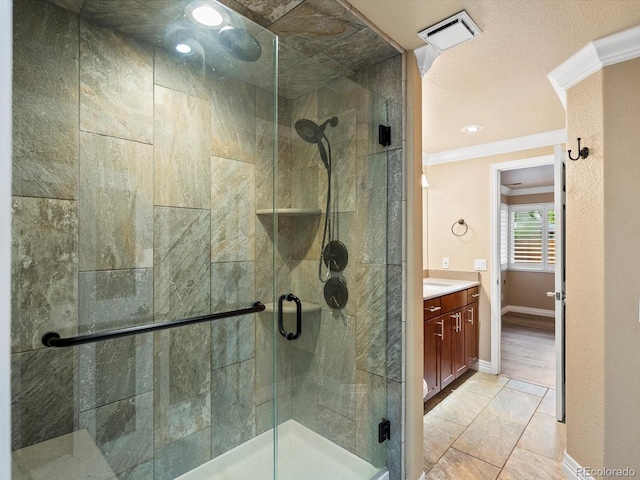 10954 W 100th Way, Broomfield, CO 80021 - bathroom with crown molding, vanity, and a stall shower