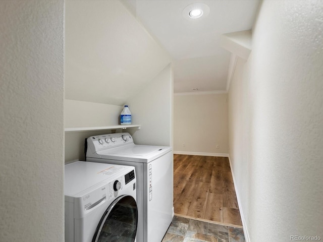 10954 W 100th Way, Broomfield, CO 80021 - washroom featuring washer and clothes dryer, crown molding, and a textured wall