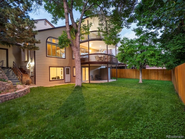 10954 W 100th Way, Broomfield, CO 80021 - rear view of house with a fenced backyard, stairway, and a patio area