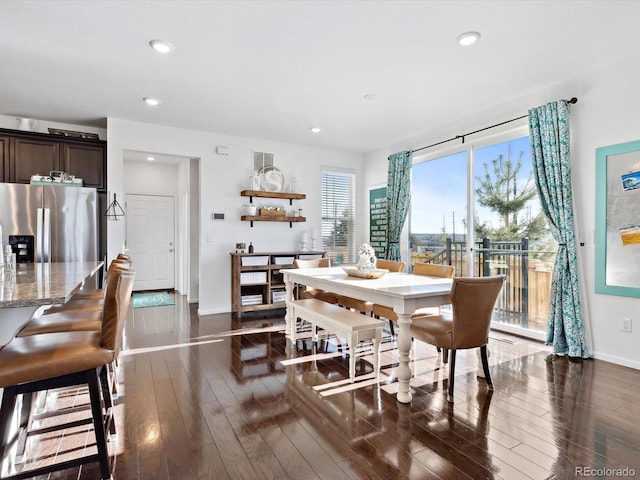 dining space featuring dark wood-type flooring