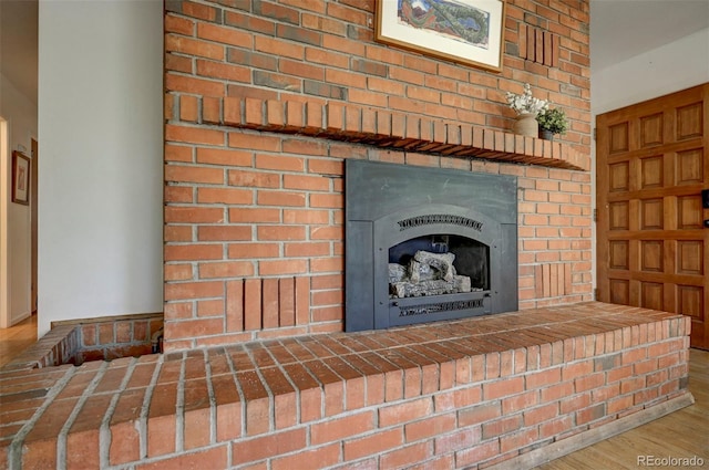 4665 Fox Rd, Cascade, CO 80809 - detailed view of wood finished floors and a fireplace with raised hearth