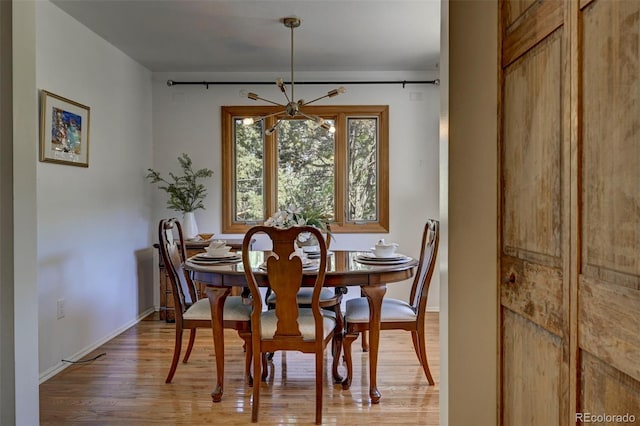 4665 Fox Rd, Cascade, CO 80809 - dining room featuring a chandelier and light wood-style flooring